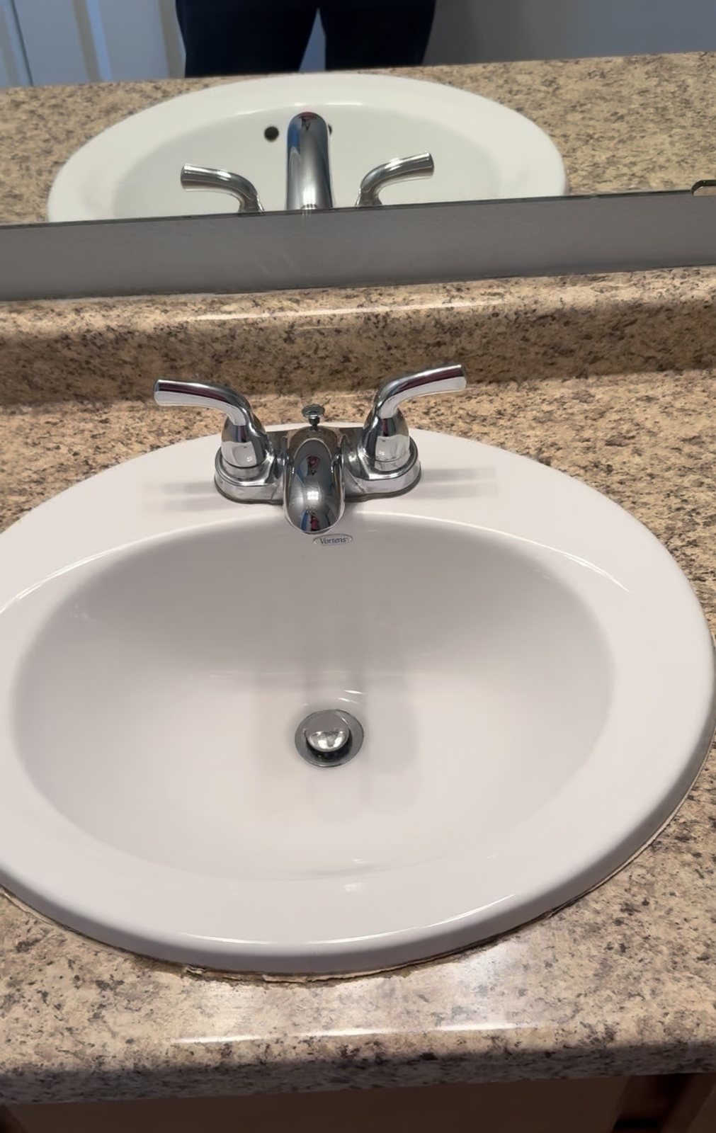 After cleaning: clean bathroom sink and polished faucet