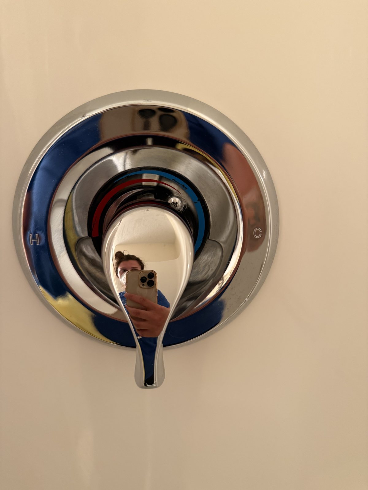 After cleaning: polished chrome shower control and clean surrounding surface